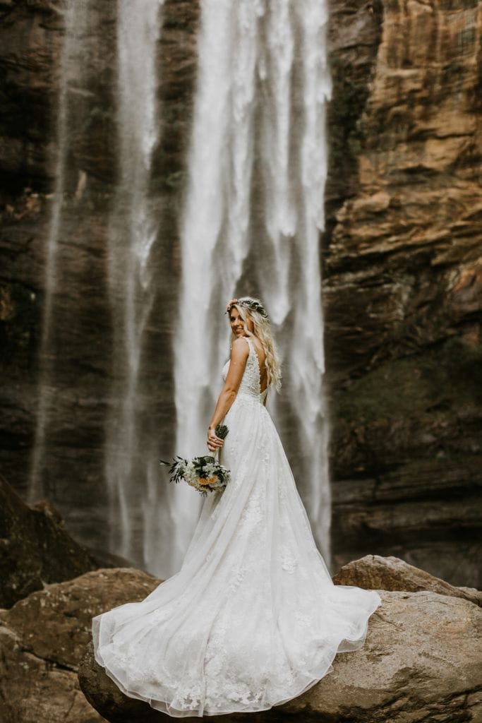 waterfall photography of bride
