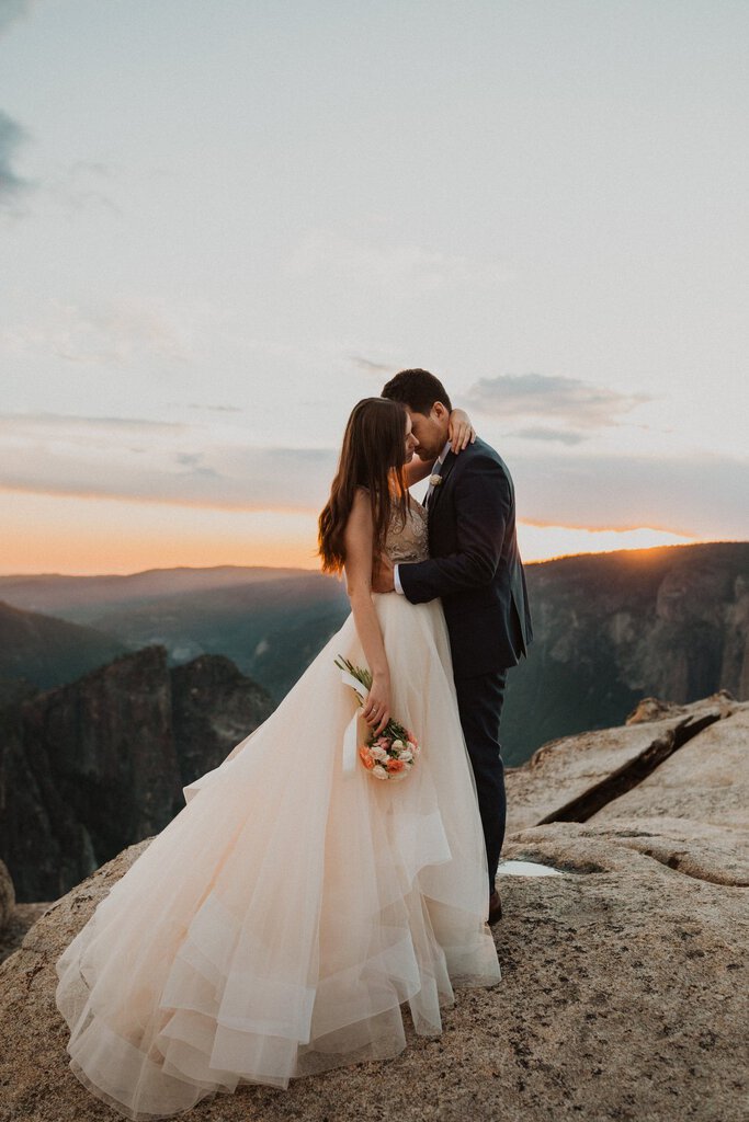Intimate moment for bride and groom at Taft Point.