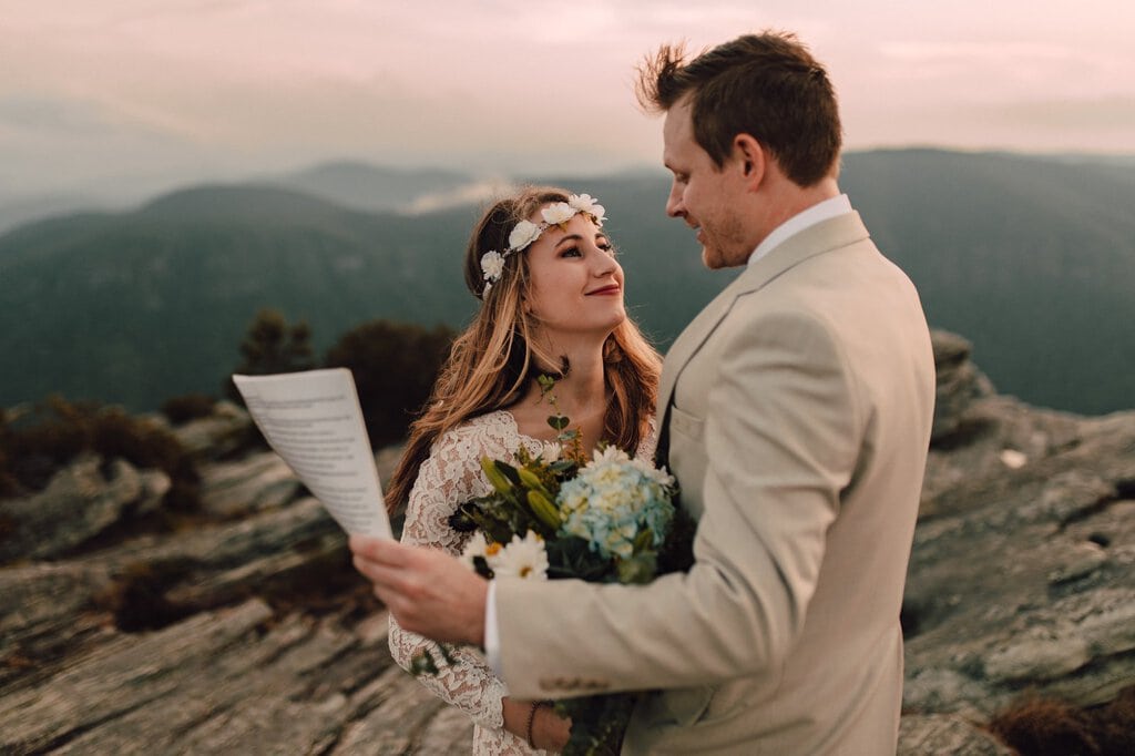 Exchanging vows with one another on a mountain.