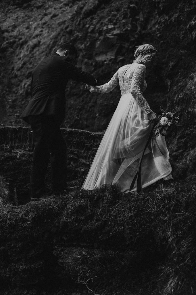 Bride and groom hike in Iceland elopement.