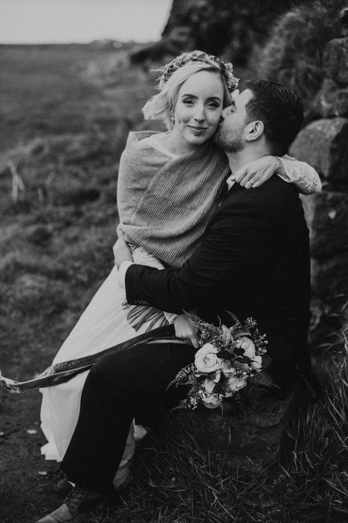 Groom kisses his bride in Iceland.