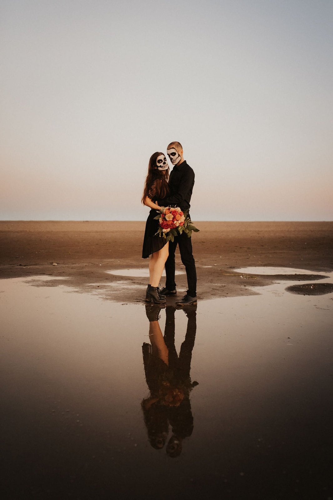 couple at the beach for fall shoot.