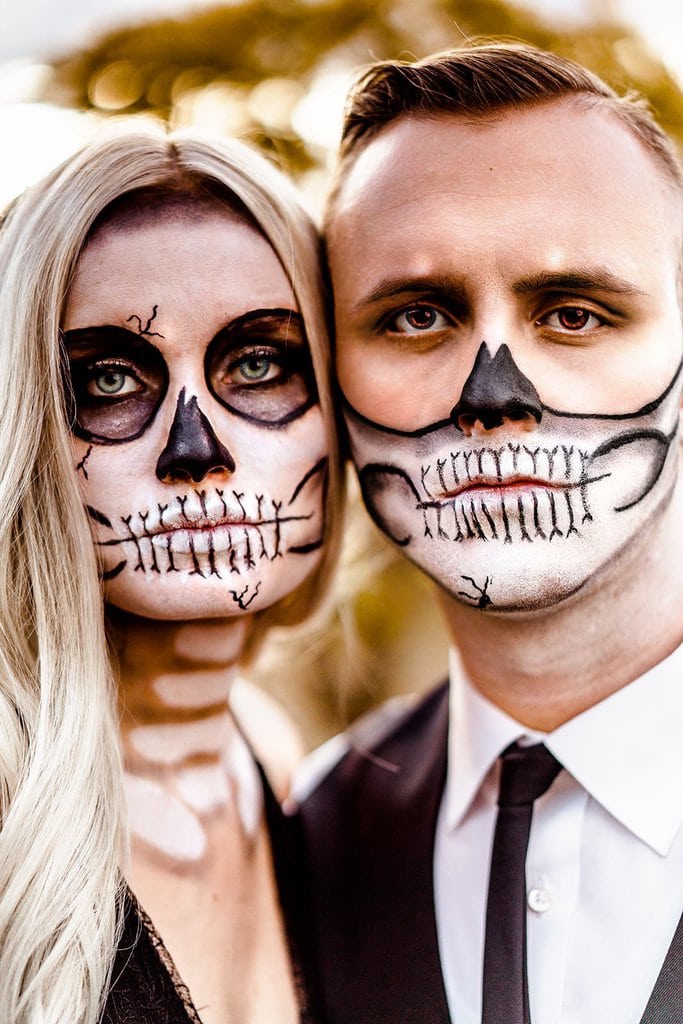 Bride and groom skull face pain.