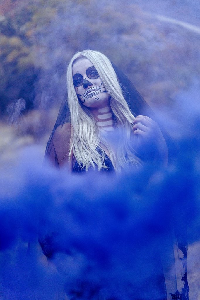 Blue smoke bomb bride with skull paint.