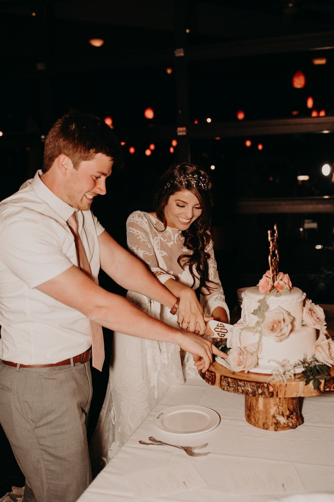 bride and groom cut their wedding cake.