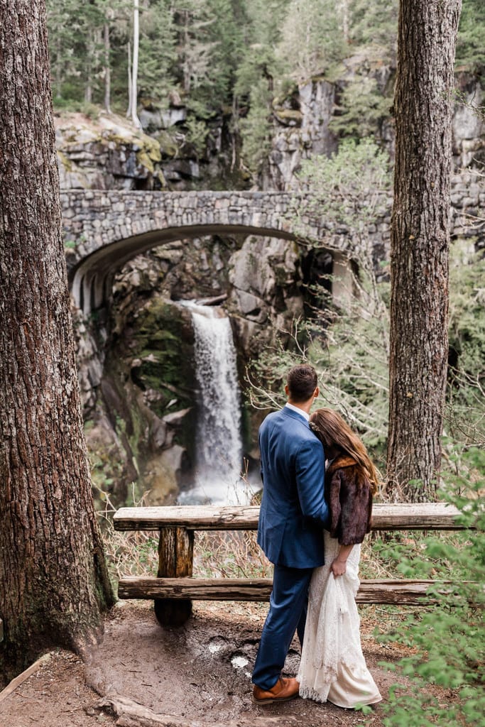 bride and groom portrait by waterfall.