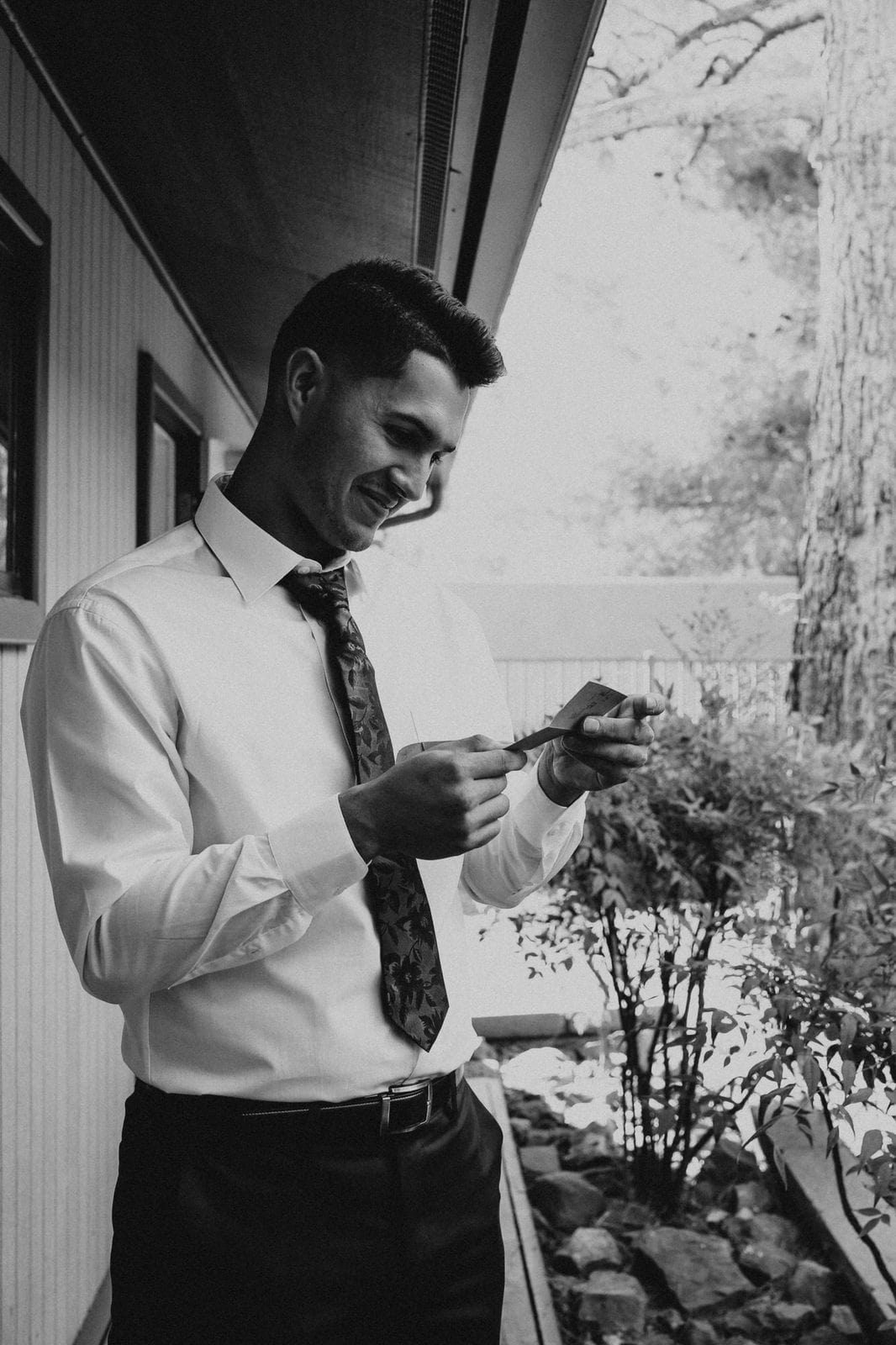 groom reading card from bride.