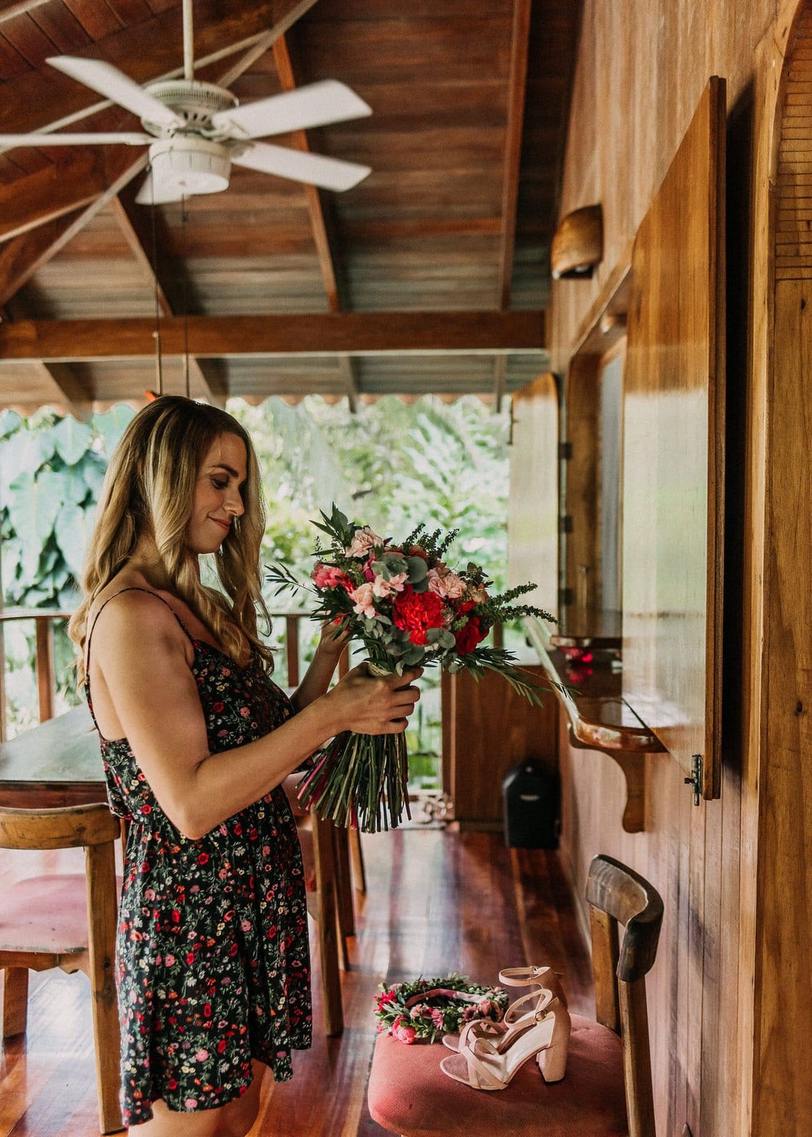 bride admiring wedding bouquet.