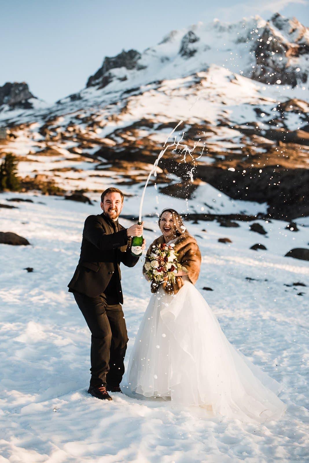 popping champagne bottles during elopement