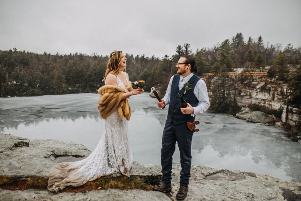 bride and groom celebrating at Minnewaska State Park.