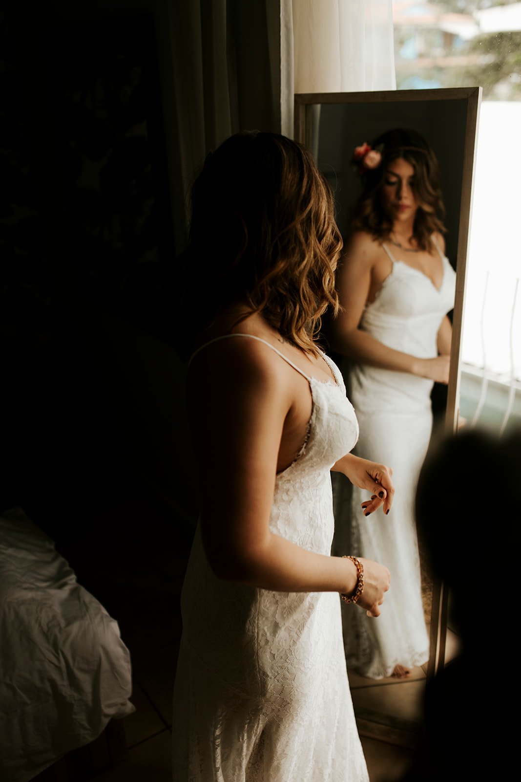 bride putting on her dress